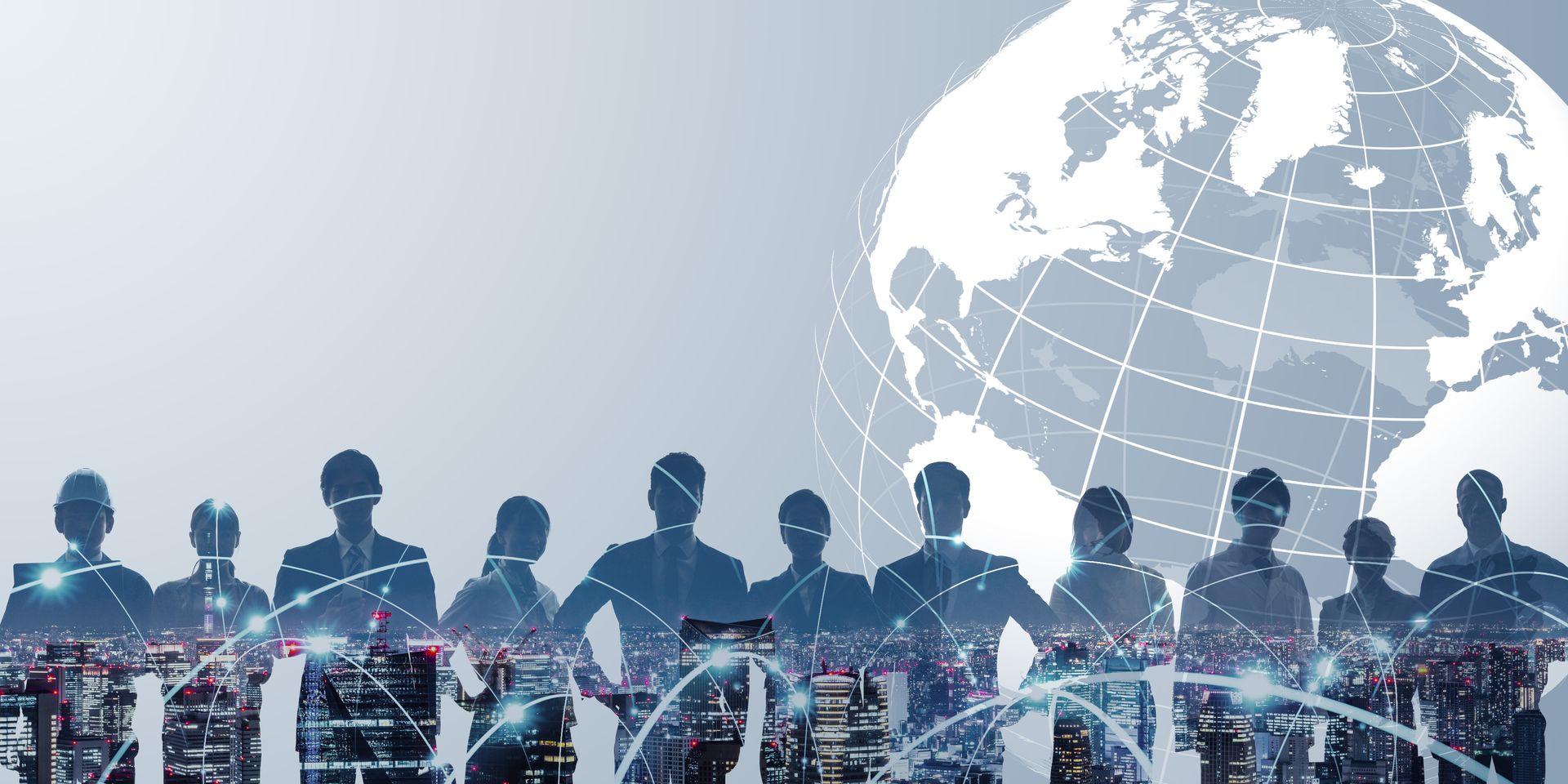 Silhouettes of business leaders against a connected globe and city skyline
